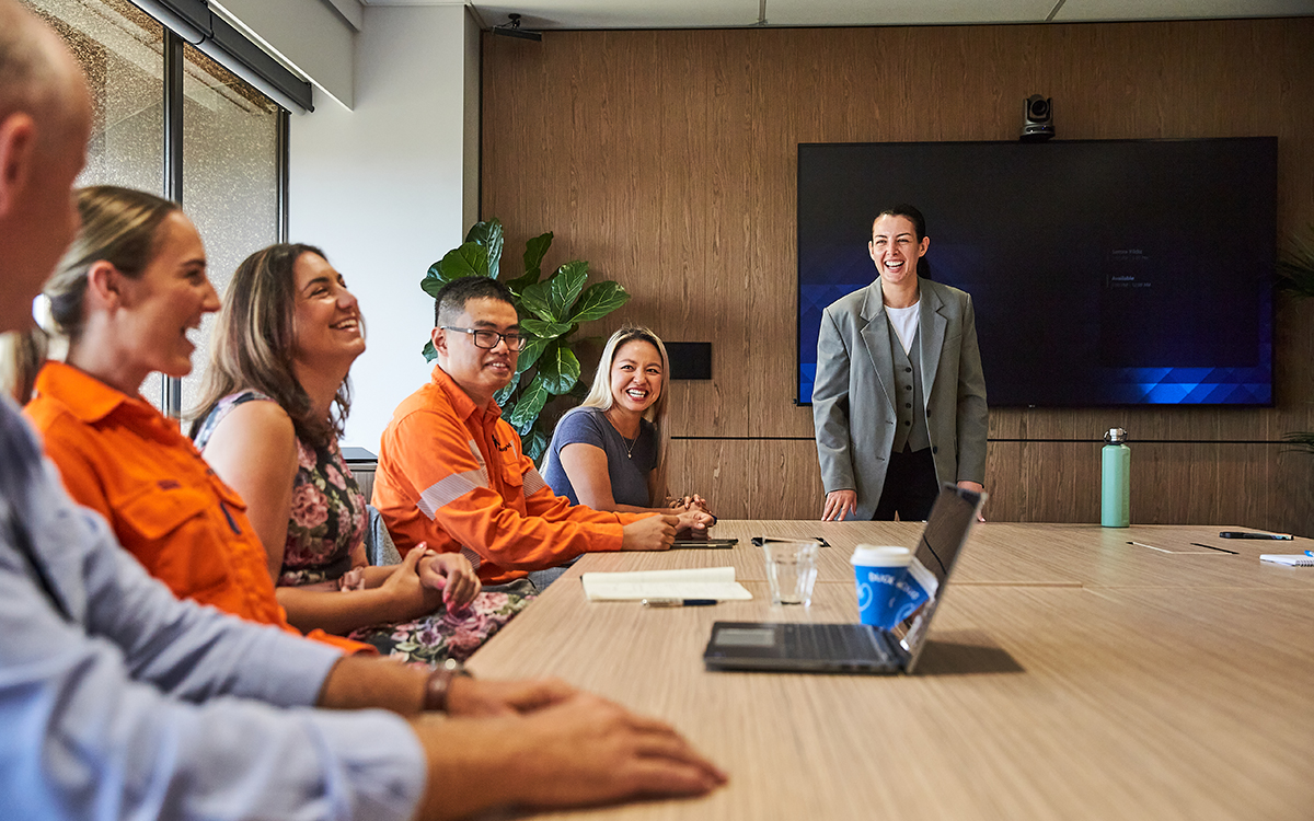 Ausgrid female employee presenting to a group of field and officer employees 