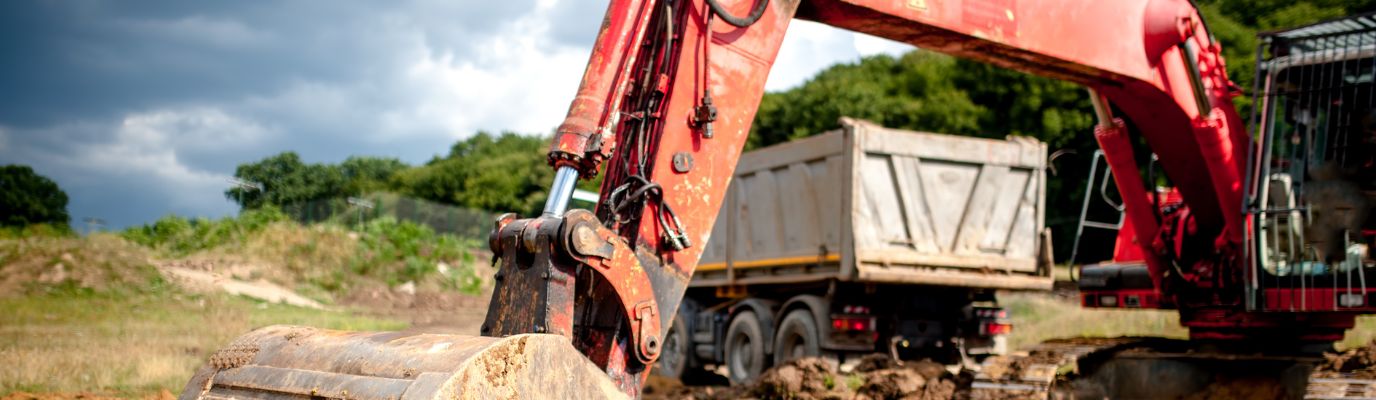 Digger excavating on site