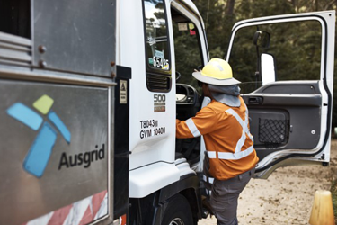 Ausgrid field worker getting into an Ausgrid truck